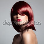 Beautiful red hair model with perfect glossy hair. Close-up port