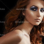 Fashion woman model with glitter evening make-up, shiny long curly hair